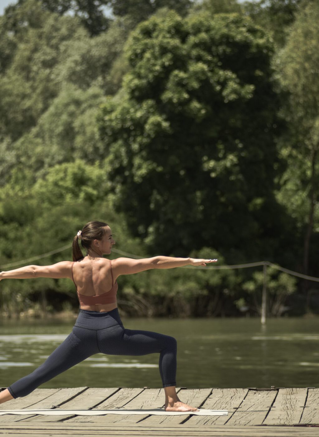 Yoga will allow you to discover your place of peace A young woman practicing yoga outdoors at the river